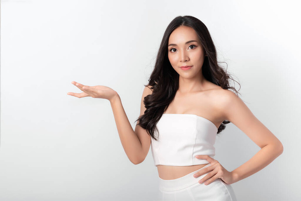Portrait of Beauty Asian Women Attractive Girl in Fashion Posing with Smiling Face Wearing White Dress on White Background for Cosmetic or Healthy Media - Foto, Imagem