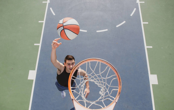 Basketball street player with basketball ball outdoor. - Valokuva, kuva