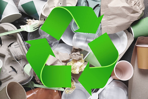 Many different garbage and symbol of recycling - Zdjęcie, obraz
