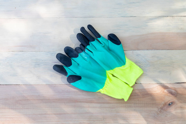 Working gloves on a wooden background - Photo, Image