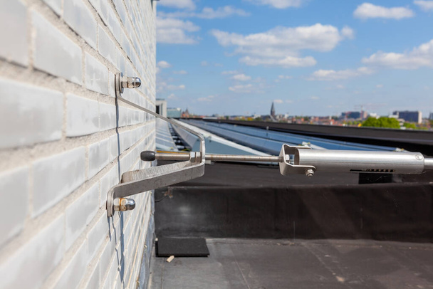 this stainless steel safety cable on the roof is for your own safety - Photo, Image