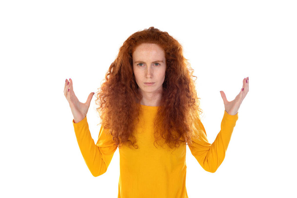 Young redhead girl wearing yellow sweater over white background raising hands up isolated on a white background - Photo, Image