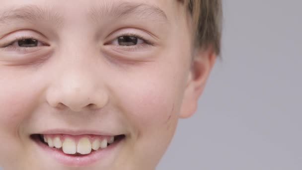 Caucasian boy of 9 years smiles in a tender manner. - Footage, Video