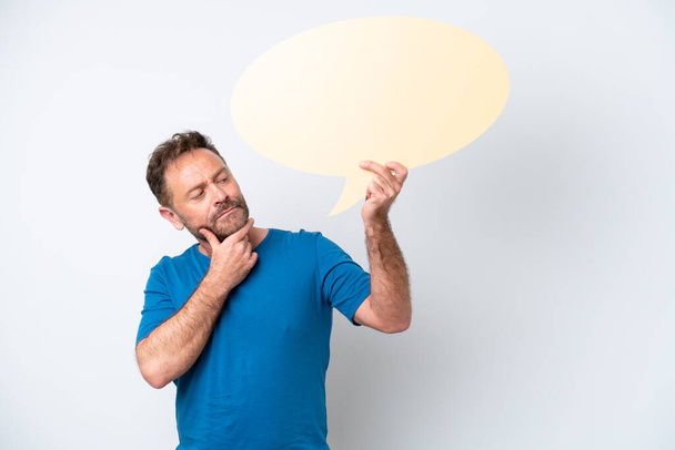 Middle age caucasian man isolated on white background holding an empty speech bubble and thinking - Foto, imagen