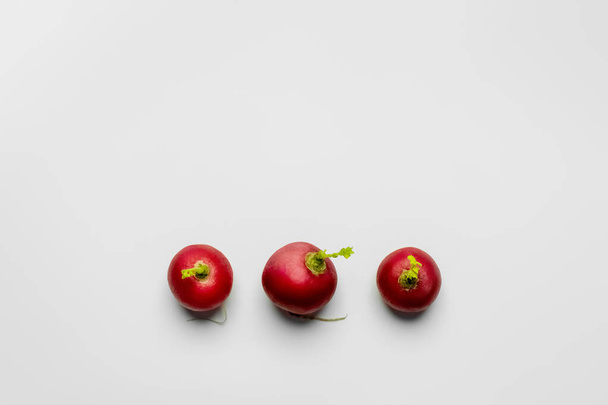 Top view of organic radishes on white background flat lay - Photo, Image