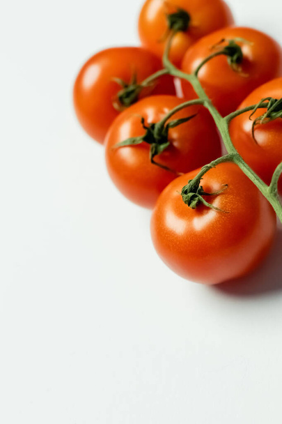Close up view of fresh cherry tomatoes on white background  - Fotó, kép
