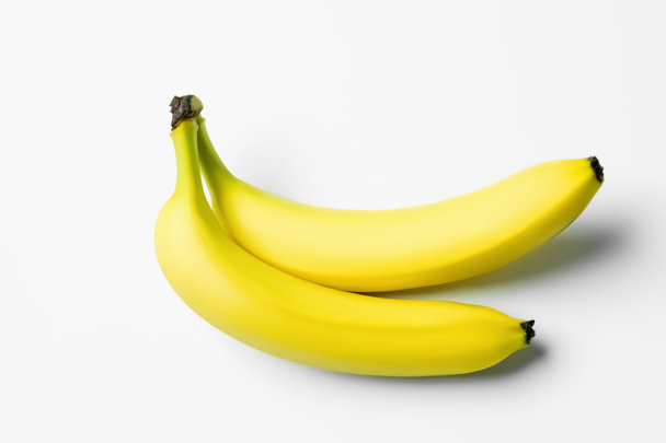 High angle view of ripe bananas on white background  - 写真・画像