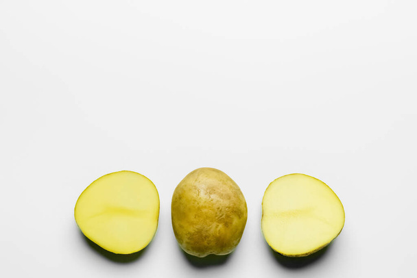 Top view of fresh potatoes on white background - Foto, afbeelding