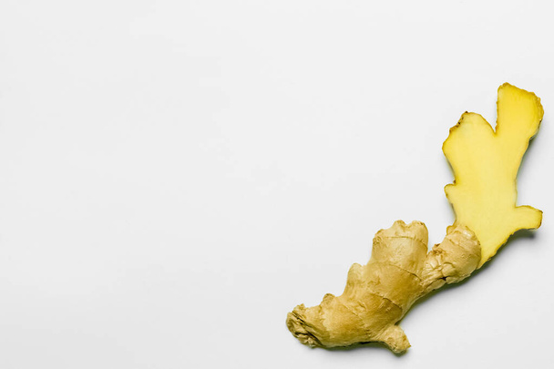Top view of cut ginger on white background - Foto, afbeelding