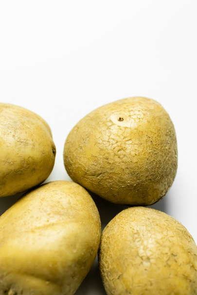 Close up view of potatoes on white background  - Foto, Imagen