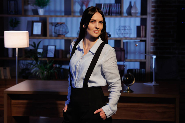 Portrait of young attractive businesswoman in office. Cinematic lighting - Foto, Imagem