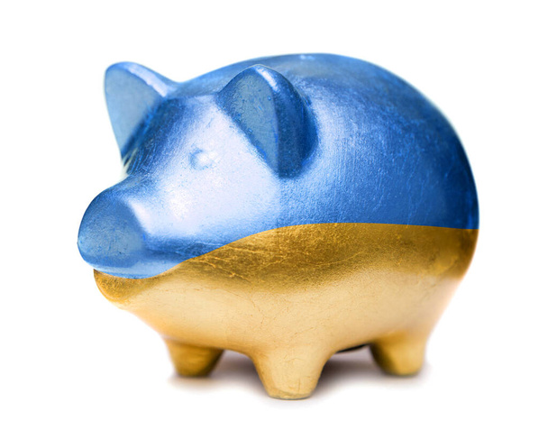Golden pig moneybox in the color of Ukrainian flag - Zdjęcie, obraz