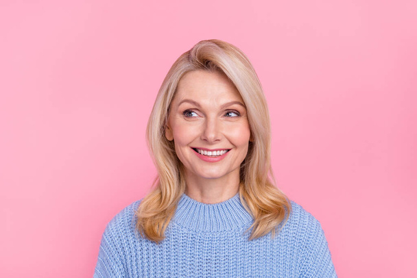 Photo of senior funky blond lady look promo wear blue pullover isolated on pink color background - Foto, Imagen