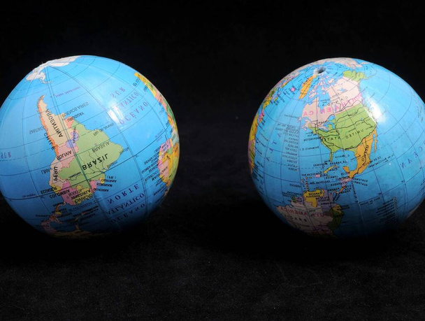 Two Globes on a Dark Background - Time Concept - Fotó, kép