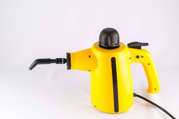 Obrázek žlutého stroje na čištění horkých par - Fotografie, Obrázek