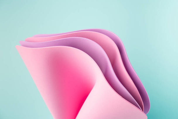 Summer colors in wavy sheets on a mint background. Abstract bright backdrop. - Photo, Image