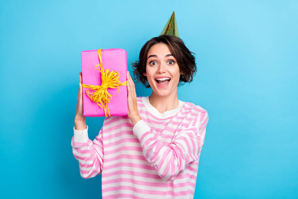 Photo of charming ecstatic overjoyed lady receive unexpected birthday gift present isolated on blue color background - Foto, Bild