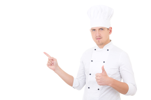 młody przystojny mężczyzna kucharz kciuki i pokazując lub jakiegoś - Zdjęcie, obraz