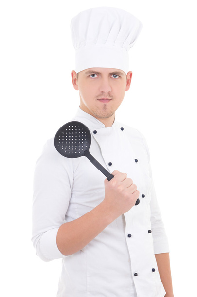 jeune homme en uniforme avec la cuillère de sauce isolé sur blanc chef - Photo, image