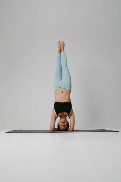 Healthy life and natural balance, Yoga woman posing in the studio. Vertical. - Фото, изображение