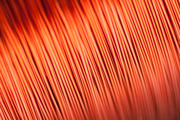 Copper wire for electronics close-up with a focus on the center and blurred edges of the right and left. Designed for the production of electronic components in the electrical industry. - Photo, Image
