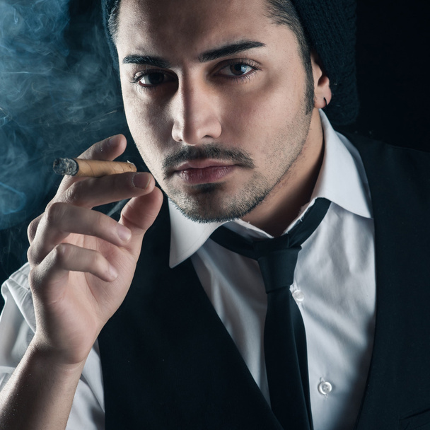Young man close up portrait with cigar - Photo, Image