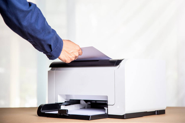 Printer, copier, scanner in office. Workplace ,photocopier machine for scanning document printing a sheet paper and xerox photocopy. - 写真・画像