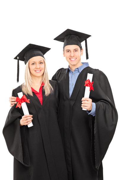 Man and woman in graduation gowns - Photo, image