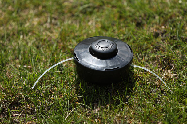 automatic sprinkler system watering the lawn on a background of green grass, close up. - Zdjęcie, obraz
