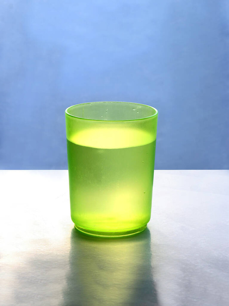 water in green glass as still life - Фото, изображение