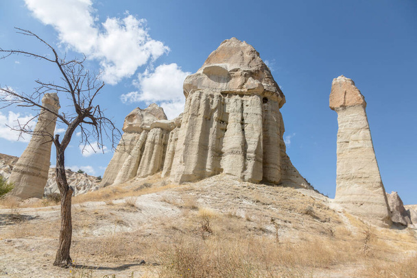 Love Valley - is truly one of the most unique places to visit in Cappadocia. The fairy chimney rock formations, towers, cones, valleys, and caves - Fotoğraf, Görsel