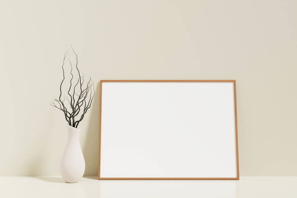 Minimalist and clean horizontal wooden poster or photo frame mockup on the floor leaning against the room wall with vase - Fotó, kép