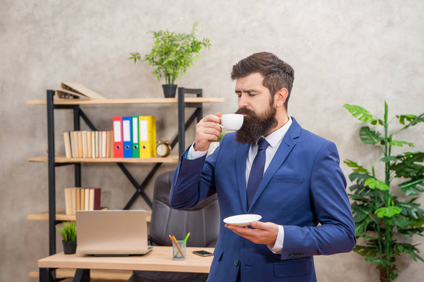 mature entrepreneur in jacket enjoy having coffee break at office, professional - Photo, image