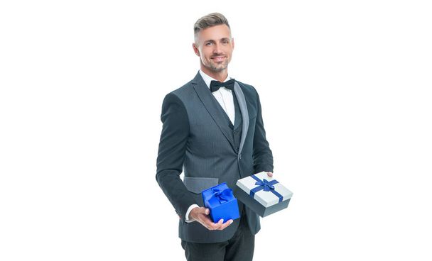cheerful businessman in tuxedo with box isolated on white. boxing day - Фото, изображение