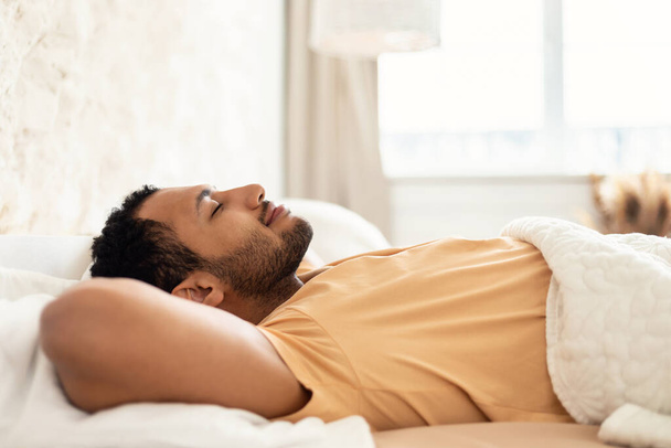 Middle Eastern Male Sleeping Lying In Cozy Bed In Bedroom - Foto, immagini