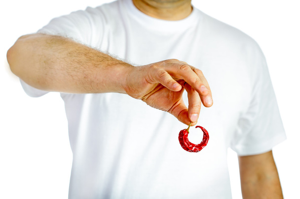 Człowiek posiadający czerwona papryczka chili - Zdjęcie, obraz