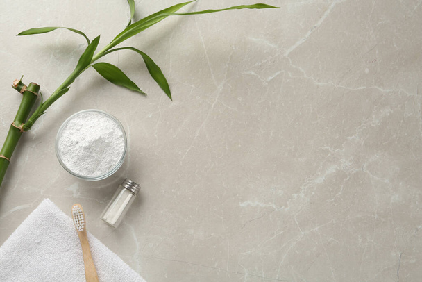 Flat lay composition with tooth powder and bamboo stem on light grey marble table, space for text - Fotoğraf, Görsel