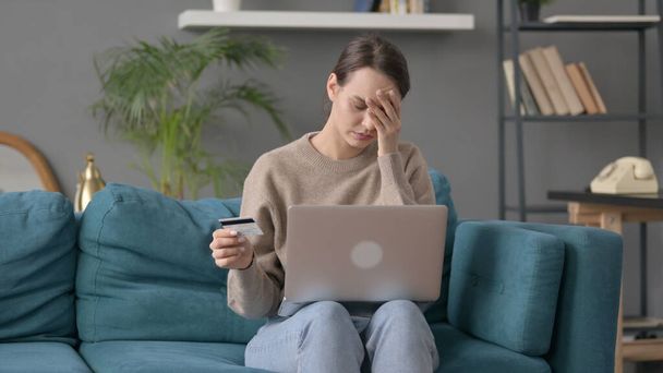 Woman with Unsuccess Online Payment on Laptop on Sofa  - Фото, зображення