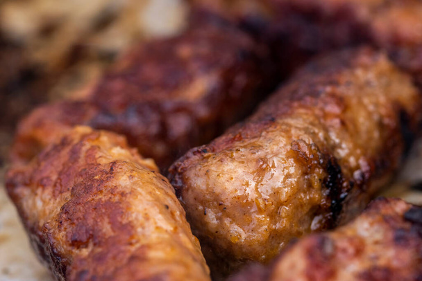 Traditional Romanian food called "mici" which consist of pork meat rolls - Photo, image
