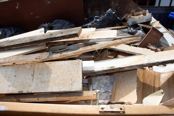House renovating DIY housing repairs Broken Timber in a Skip - Photo, image