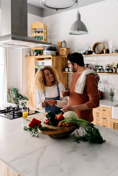 Couple preparing food in kitchen. - Fotoğraf, Görsel