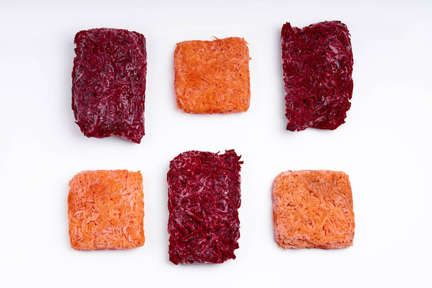 Mix bricks of frozen grated beets and carrots. Procurement of frozen food. Semifinished. - Fotoğraf, Görsel