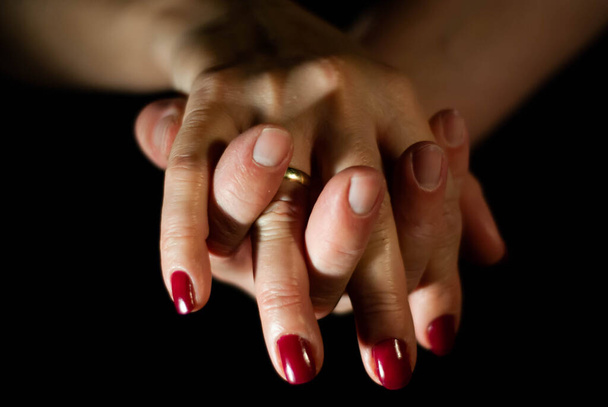 Hands of husband and wife lovingly holding hands while married for many years - Fotoğraf, Görsel