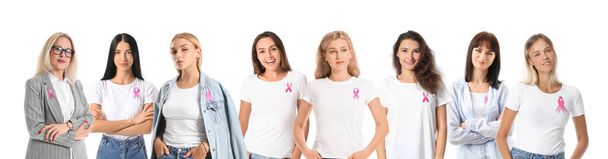 Πολλές γυναίκες με ροζ κορδέλες απομονωμένες στο λευκό. Ευαισθητοποίηση καρκίνου μαστού - Φωτογραφία, εικόνα