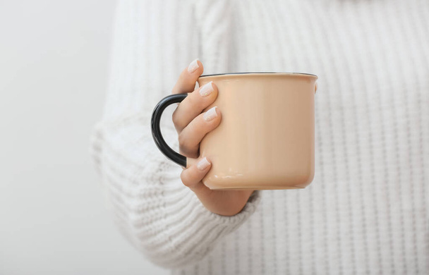 Woman with ceramic cup on white background, closeup - 写真・画像