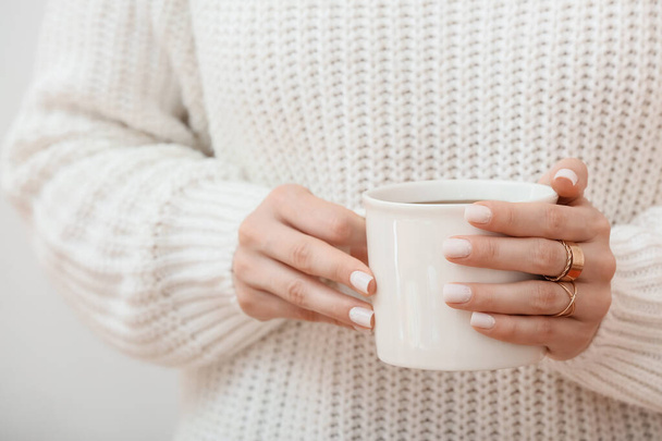 Woman holding cup of coffee, closeup - Фото, зображення