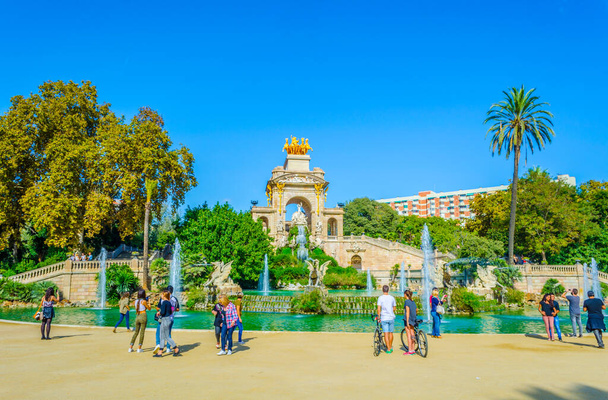 BARCELONA, SPAIN, OCTOBER 26,2014: People are strolling in front of the cascada monumental fountain in the ciutadella park Barcelona, Spain. - Photo, Image
