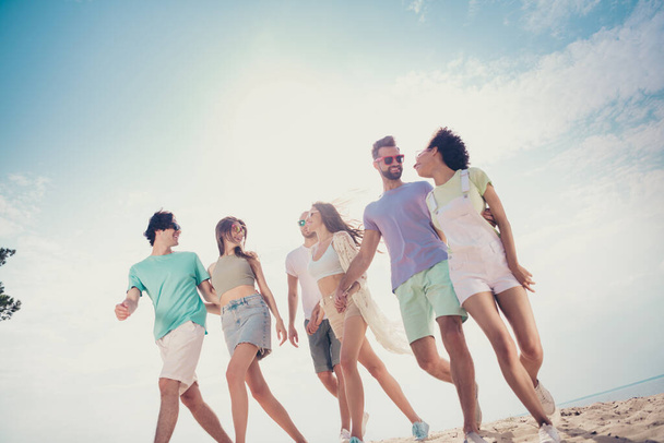 Photo of glad nice carefree friends group walk sunny weather wear casual outfit nature summer seaside beach - Photo, Image