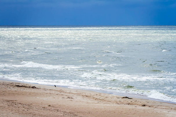 Soft waves of the sea on the sandy beach - Φωτογραφία, εικόνα