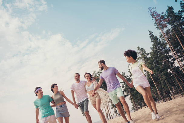 Photo of funky pretty six young buddies dressed casual outfits walking holding arms talking smiling outdoors countryside - Photo, image